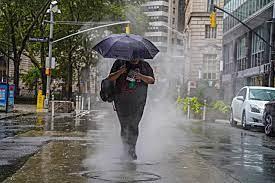 New York City Holds On to Umbrellas as Scattered Showers Linger Before Sunny Weekend