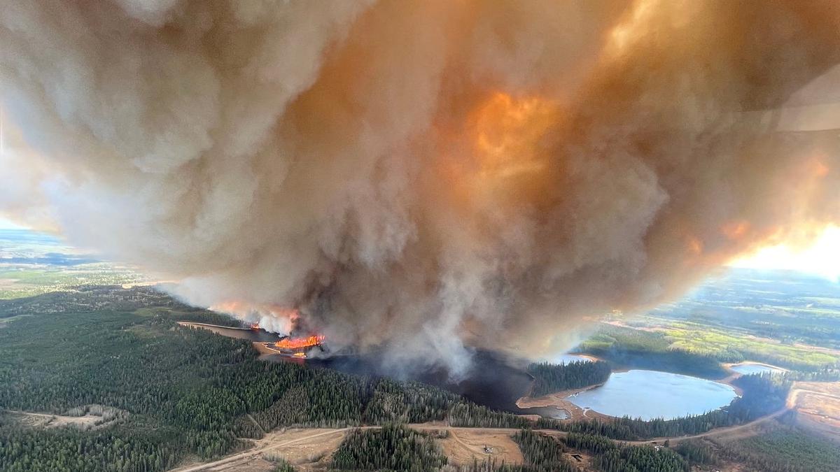 Wildfires Rage Across Canada Forcing Historic Evacuations as Smoke Blankets US Cities