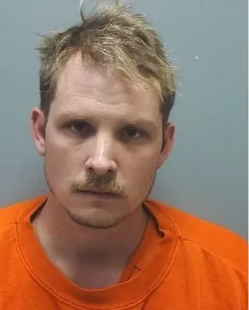 Two Men Charged in Downtown Woodstock Parking Deck Vandalism