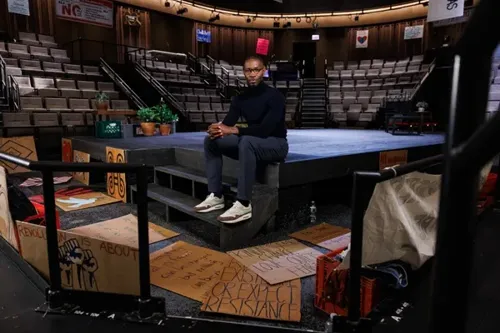 Tarell Alvin McCraney Poses on Steppenwolf Stage for Theatrical Photo Highlighting New Play 'Windfall'